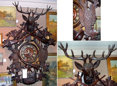 Lot 257 - Black Forest Oak and Walnut Cuckoo Clock