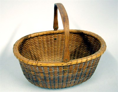 Lot 106 - Nantucket Basket Of oval form, with a swing...