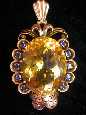 Lot 148 - Large Citrine and Sapphire Pendant The 14 kt....