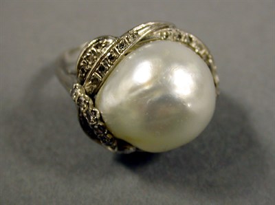 Lot 315 - Baroque Cultured Pearl and Diamond Ring 14 kt....