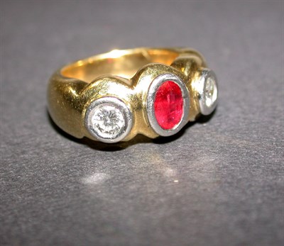 Lot 411 - Ruby and diamond ring, 18 kt. yellow gold, set...