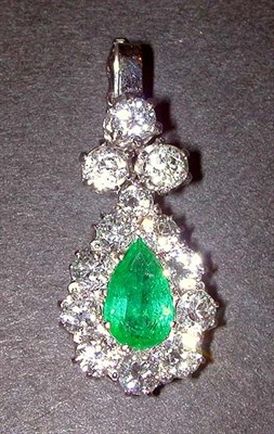 Lot 331 - Emerald and Diamond Pendant 14 kt. white gold,...