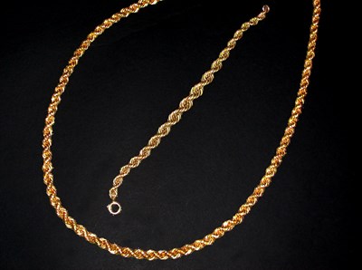 Lot 237 - Gold Rope Chain Necklace and Bracelet The 24...