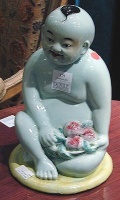 Lot 175 - Chinese Porcelain Figure of a Seated Youth