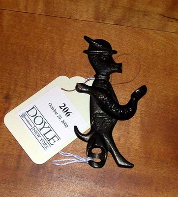 Lot 206 - Cast Iron Cap Toy In the form of a pig wearing...