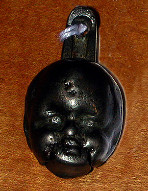 Lot 209 - Cast Iron Cap Bomb In the form of a baby's...