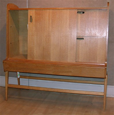 Lot 71 - Oak Cabinet on Stand Louis Paolozzi The case...