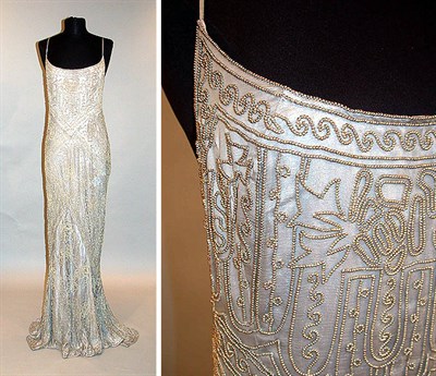 Lot 109 - Cloth of Silver Beaded Gown English, circa...
