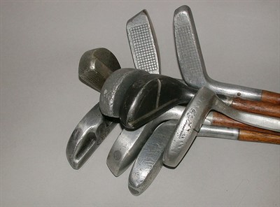 Lot 459 - A McGregor alloy putter; four Standard Golf Co....