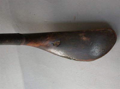 Lot 485 - A J. Buchanan thorn wood headed putter.