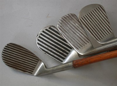 Lot 469 - A Spalding "Deadstop" deep groove mashie; a...