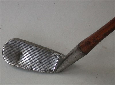 Lot 473 - A Wright & Ditson Cran "spring face" mashie,...