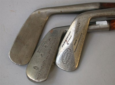 Lot 442 - A T. Stewart diamond back cleek; a Nicoll F. G....