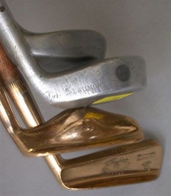 Lot 449 - A Spalding brass deep blade putter; and two...