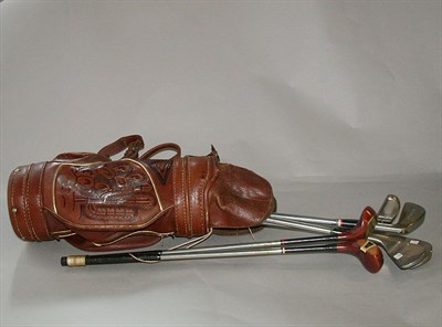 Lot 502 - A miniature hide golf bag decorated with...