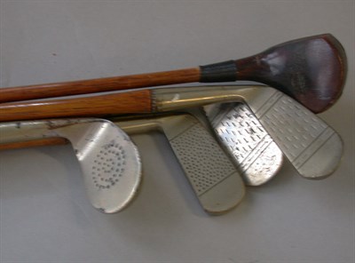 Lot 503 - A set of The Spalding miniature clubs with...