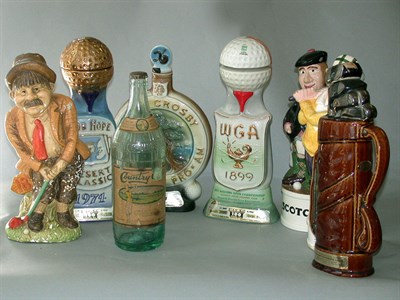 Lot 522 - A collection of decorative golfing bottles and...