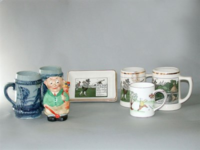 Lot 523 - A pair of Delano Crombie Rules decorated mugs,...