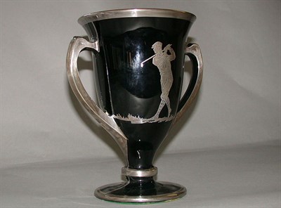 Lot 527 - An American moulded black glass and silver...