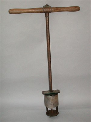 Lot 506 - A green keeper's golf hole maker in iron with...