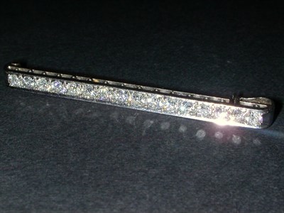Lot 364 - Diamond Bar Pin Platinum, set with sixteen...