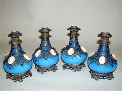 Lot 579 - Four Metal Mounted Glass Perfumes Each in blue...