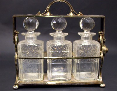 Lot 546 - Silver Plated and Glass Tantalus Containing...