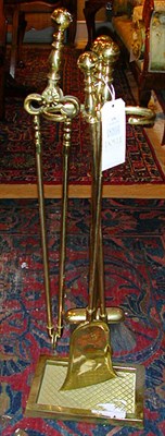 Lot 379 - Set of Georgian Style Brass Fire Tools on Stand