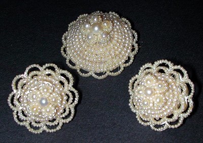 Lot 115 - Seed Pearl Pin and Earrings Set Of circular...