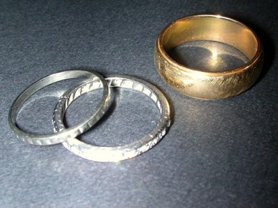 Lot 85 - Three Wedding Bands Yellow and white gold,...