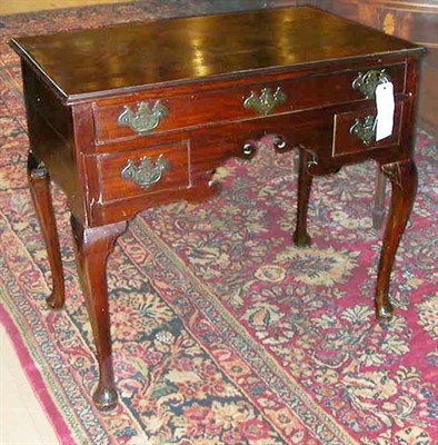 Lot 211 - Queen Anne Walnut Dressing Table The molded...