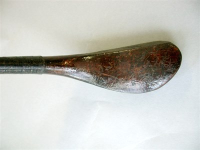 Lot 42 - A Mitchell juvenile brassed spoon in brown...