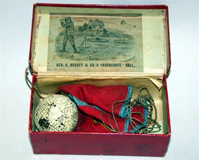 Lot 50 - A Bussey "parachute" ball box with coloured...