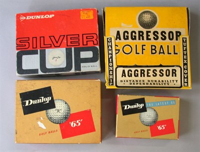 Lot 92 - A boxed dozen Aggressor balls; a Silver Cup 12...