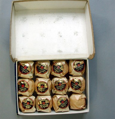 Lot 110 - A Dunlop "book" 12 box with twelve wrapped...