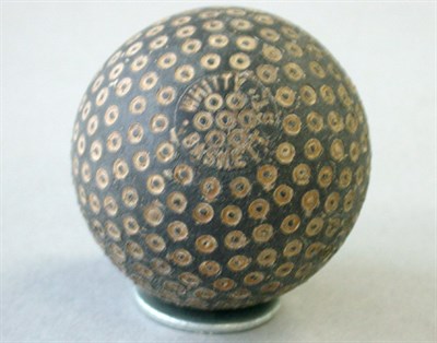 Lot 208 - A Whitty Basnett tiny ring ball (some paint to...