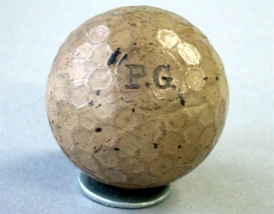 Lot 214 - A P.G. honeycomb ball, (most paint, some hacks).