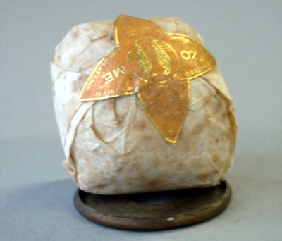 Lot 221 - A wrapped Zome with orange/gold paper label.