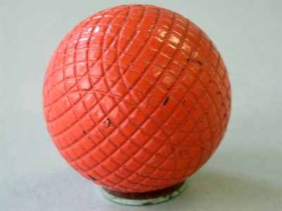 Lot 223 - A Silvertown mesh gutty with orange/red paint,...