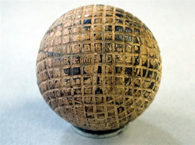 Lot 231 - A Wisdens remade mesh gutty ( hacked but good).