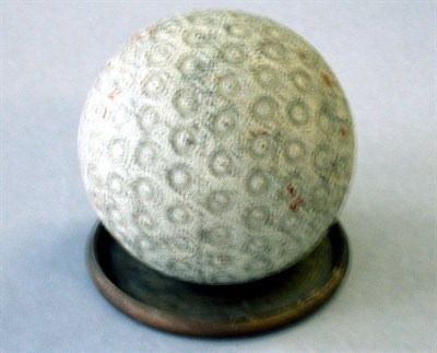 Lot 247 - A small ring rubber core marked 143 to equator...