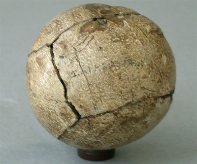 Lot 275 - A T. Alexander feather ball with a chip to...