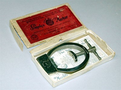 Lot 283 - A Simplex chromed metal golf ball marker,...