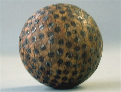 Lot 292 - An antique hardwood Kolf ball with rings of...