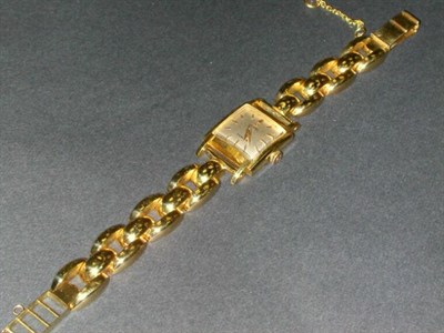 Lot 224 - Lady's Gold Wristwatch The 14 kt. yellow gold...