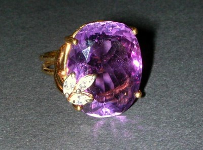 Lot 122 - Amethyst and Diamond Ring The 14 kt. yellow...