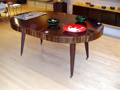 Lot 125 - Walnut Extension Dining Table The circular top...