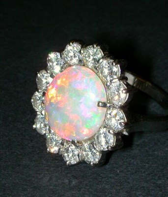 Lot 400 - Opal and Diamond Ring 18 kt. white gold, set...