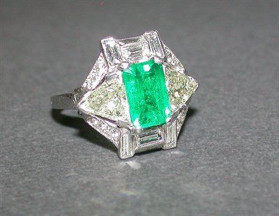 Lot 439 - Emerald and Diamond Ring Platinum, set to the...
