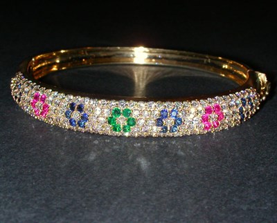 Lot 416 - Diamond and Multicolored Stone Bangle Bracelet...